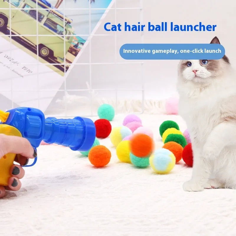 Pet toy set showing 30cm plush launcher gun and several soft 3cm yarn balls for dog fetch games