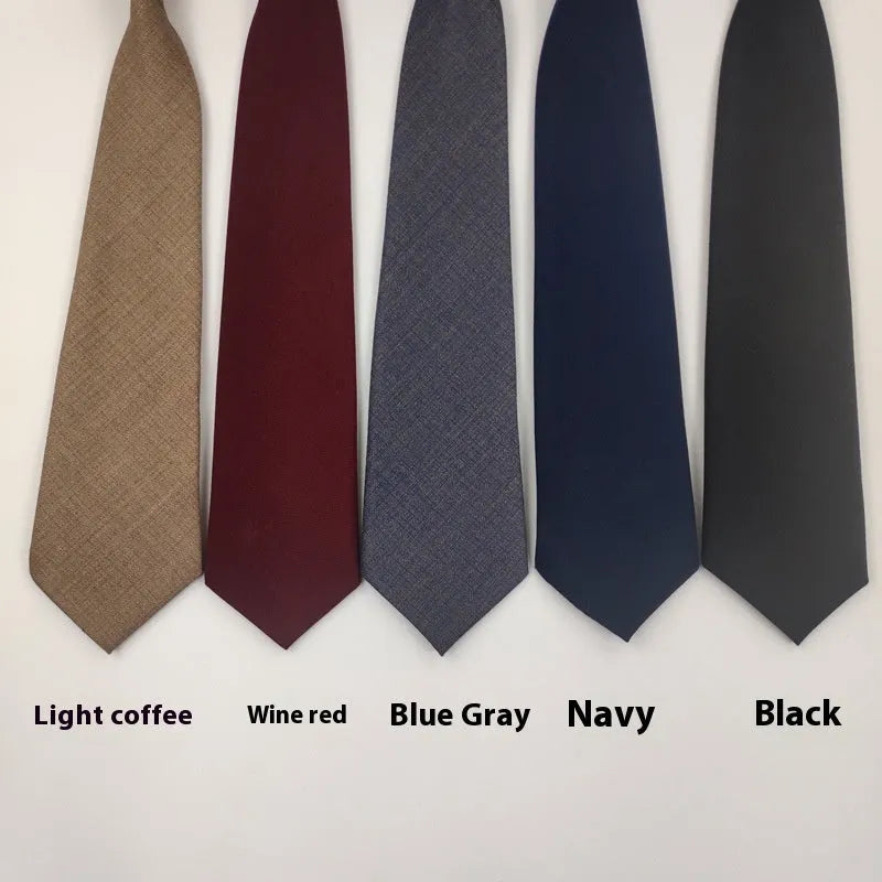 Men's solid colour cotton bow tie in arrow style, shown in navy blue.