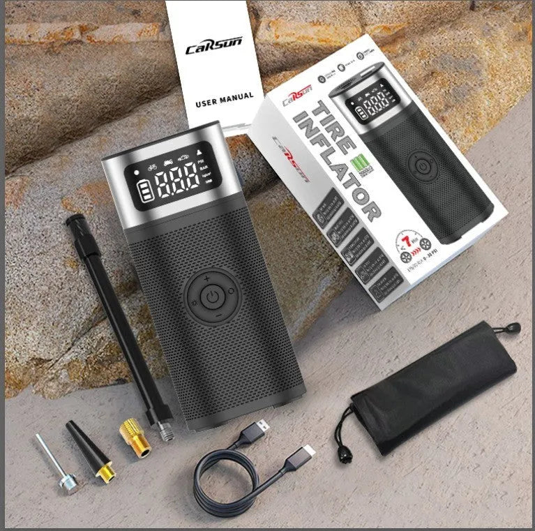 Black portable wireless air pump with USB charging cable and multiple nozzle attachments including bicycle, ball, and swimming ring connectors