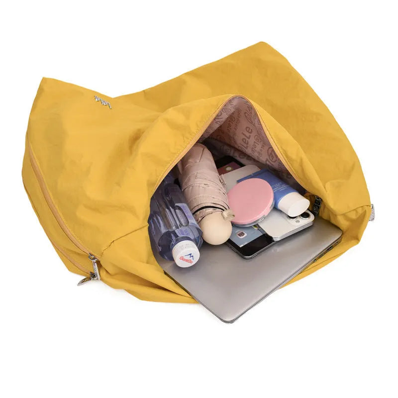 Women's heart-shaped underarm bag in nylon with large capacity, shown in available colours