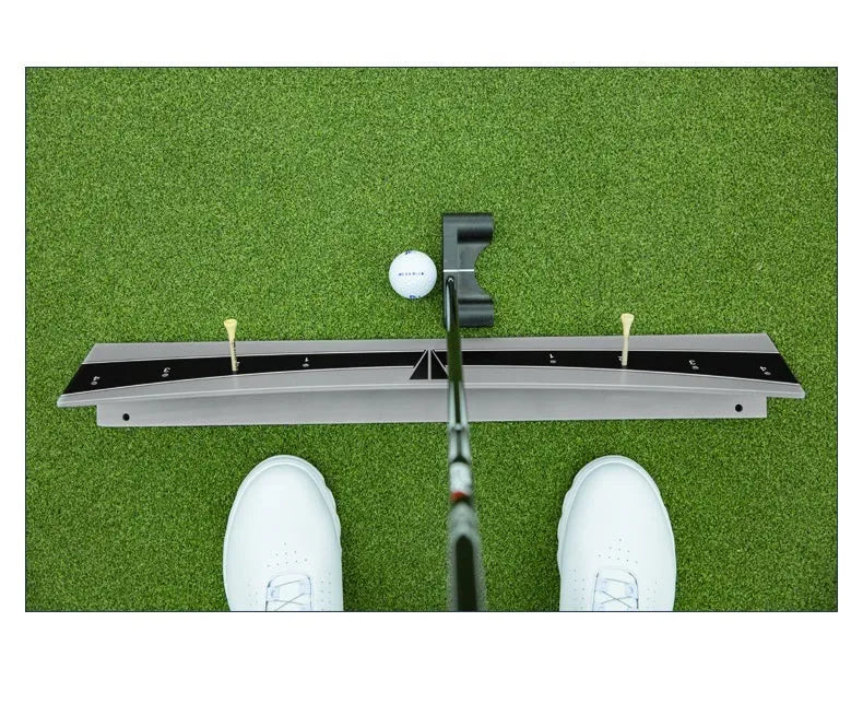Golf putter trajectory balance simulator with adjustable push rod on a practice green.