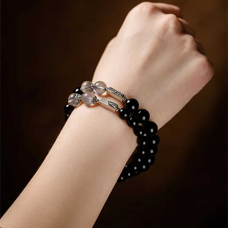 Obsidian Buddha beads couple bracelet DIY kit showing 8mm and 10mm beads with stringing materials