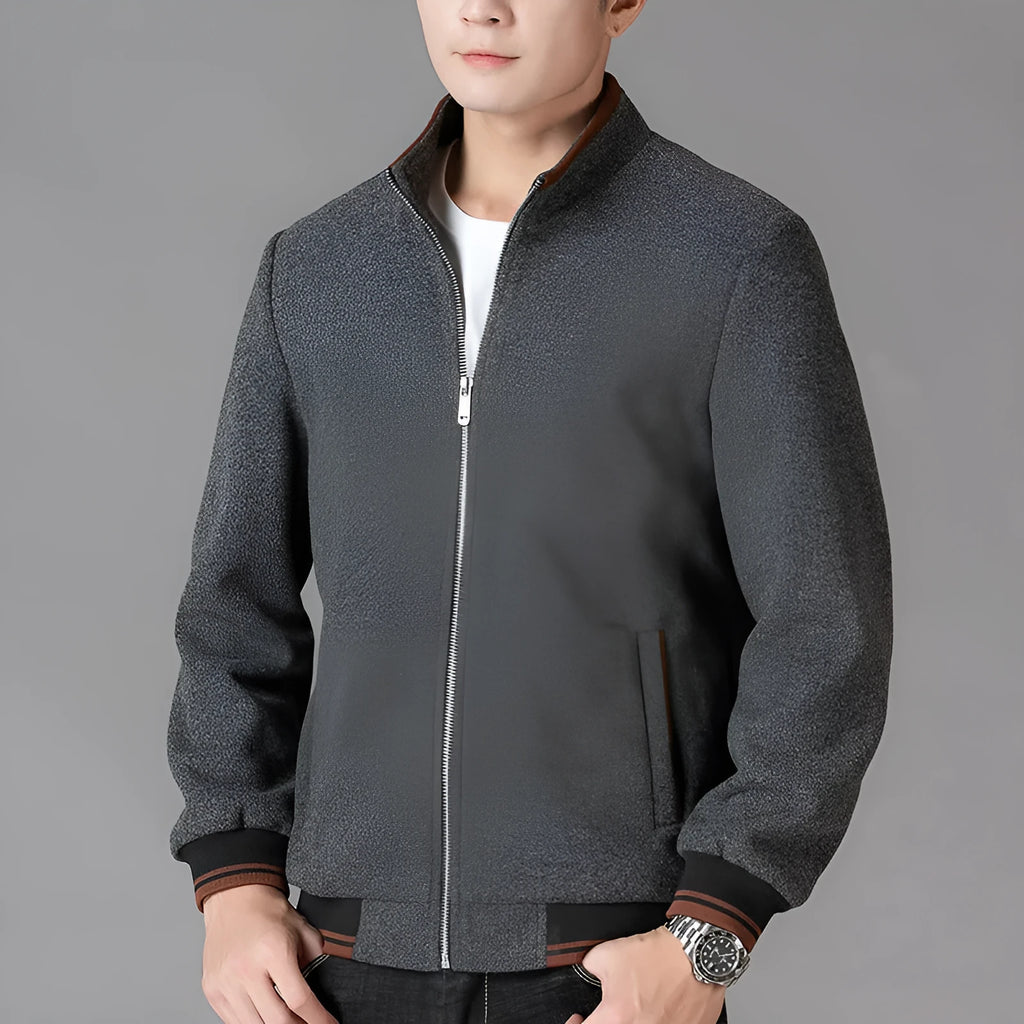 Men's grey polyester fleece sports jacket with long sleeves and a stash pocket on the chest.