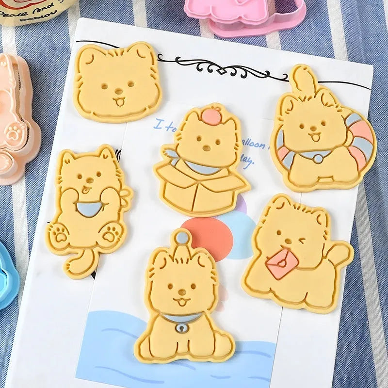 Three dimensional plastic biscuit mold with puppy cartoon designs including puppy head and birthday hat