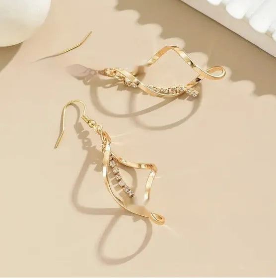 Gold geometric spiral design earrings with oval diamond shape for women