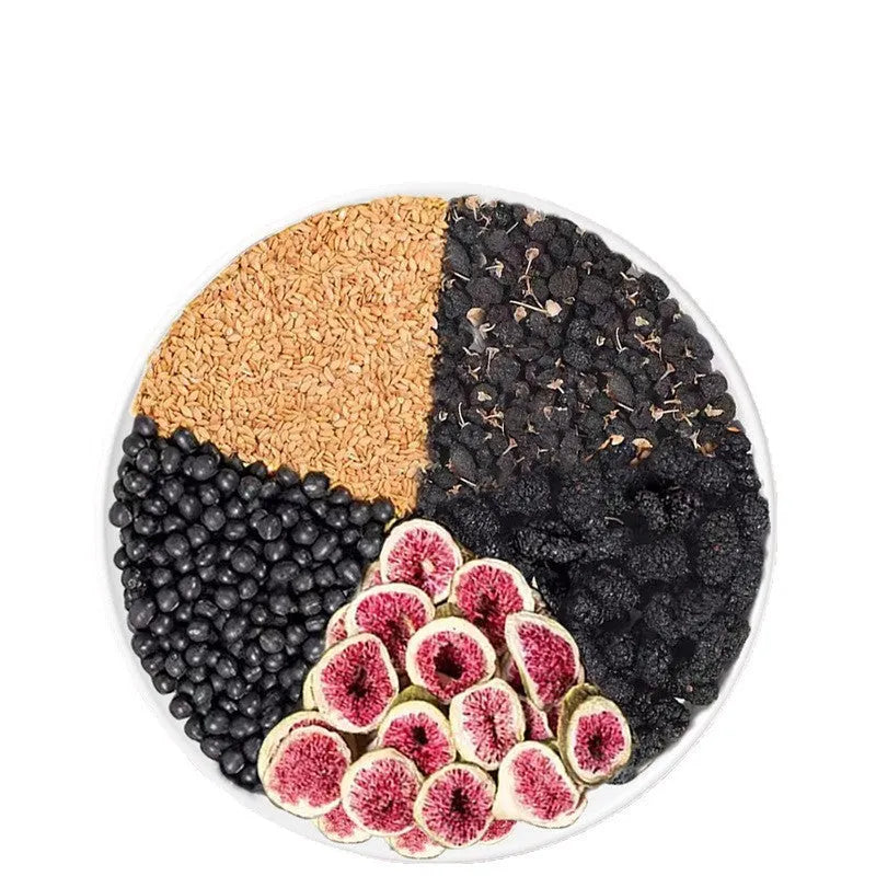 Box of black wolfberry mulberry flaxseed fig tea packets with a free white cup