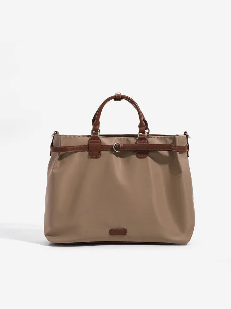 Women's nylon tote bag in creamy white with multiple internal pockets and three shoulder straps.