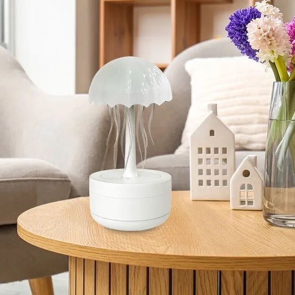 White jellyfish design humidifier and essential oil diffuser with colourful LED night light on desktop