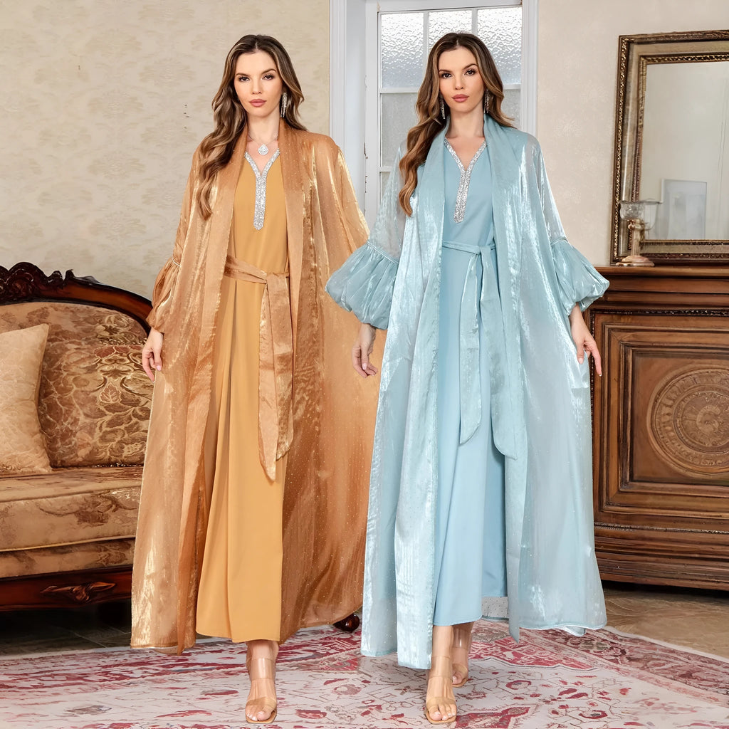 Blue Arabic style two-piece dress with long sleeves, long skirt, and rhinestone decoration.