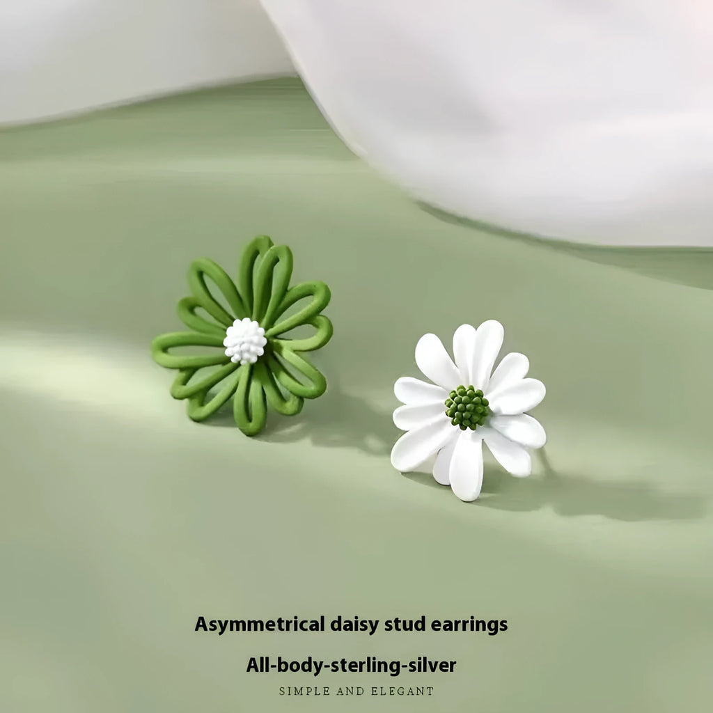 A pair of cartoon-style flower stud earrings made from alloy, shown in blue and orange colour contrast.