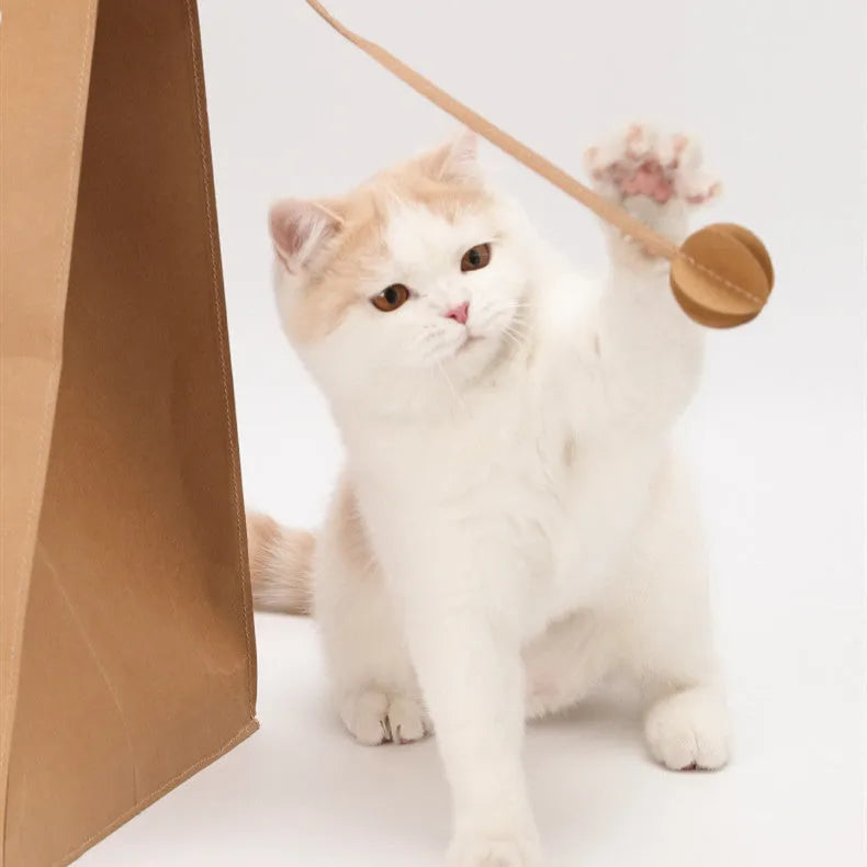 Brown kraft paper and cardboard integrated cat bed with built-in scratch board.