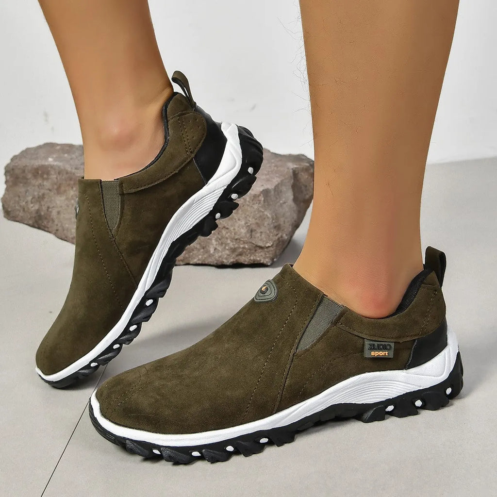 Men's grey slip-on shoes with round toe and shallow opening on rubber sole