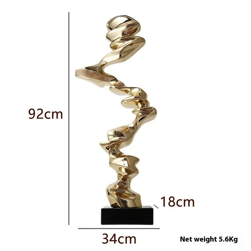 Minimalist abstract still life ornament made from natural resin in a choice of gold, silver, or blue finish.