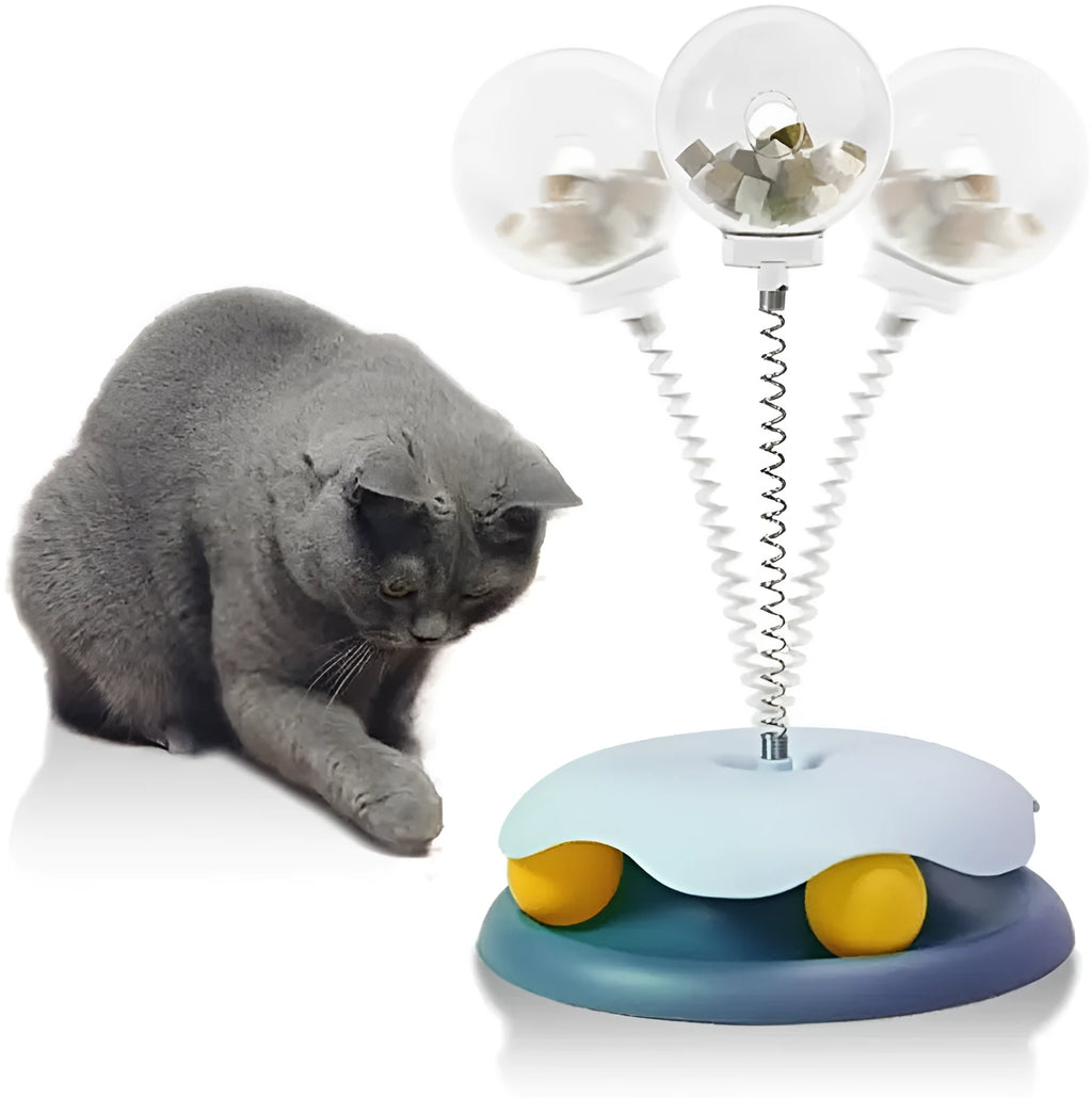 Blue and green interactive cat treat dispenser toy with a track ball for slow feeding and play.