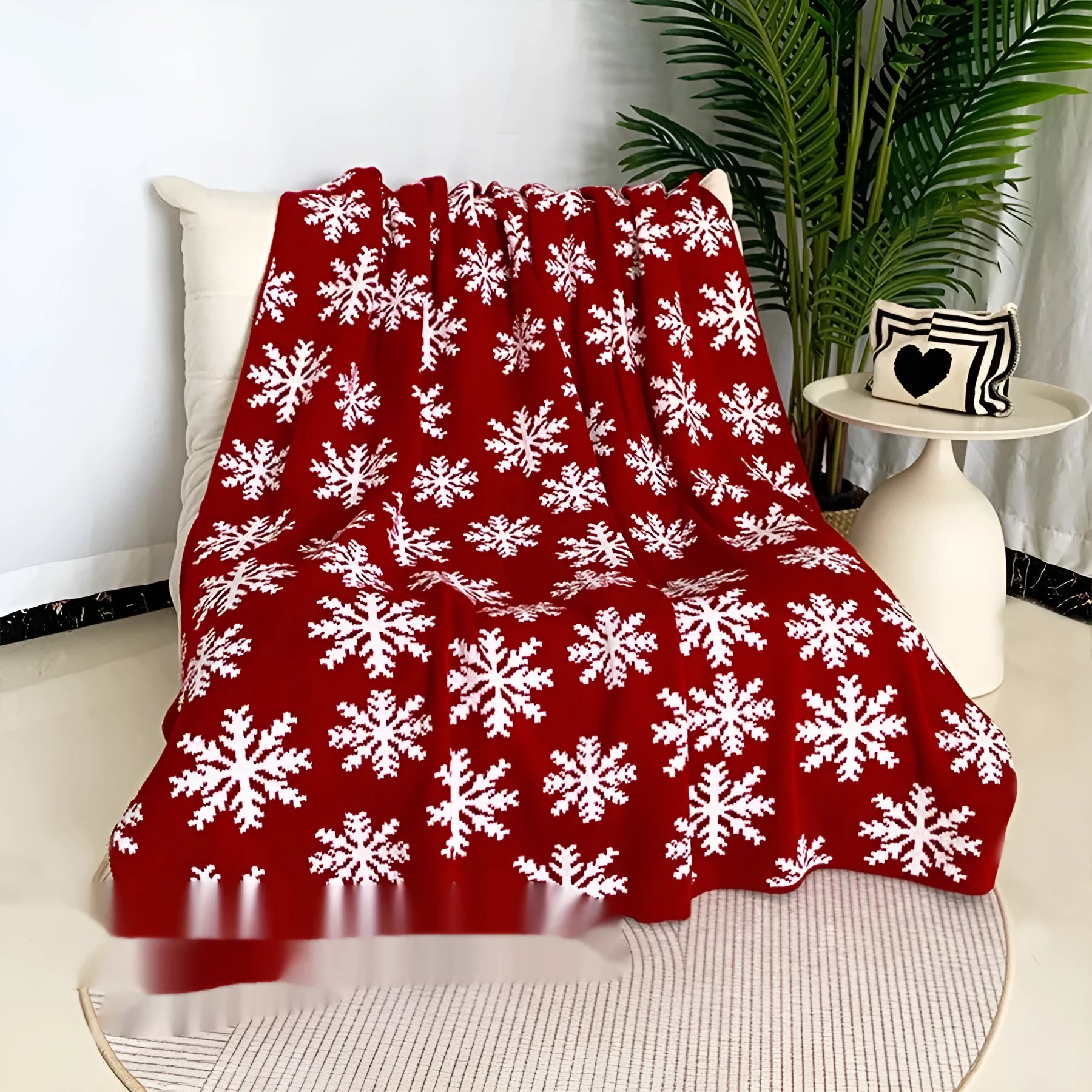 Personalised acrylic Christmas blanket with cartoon reindeer or snowflake pattern on sofa