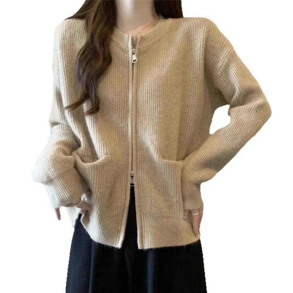 Beige viscose fibre sweater coat cardigan with long sleeves laid flat.