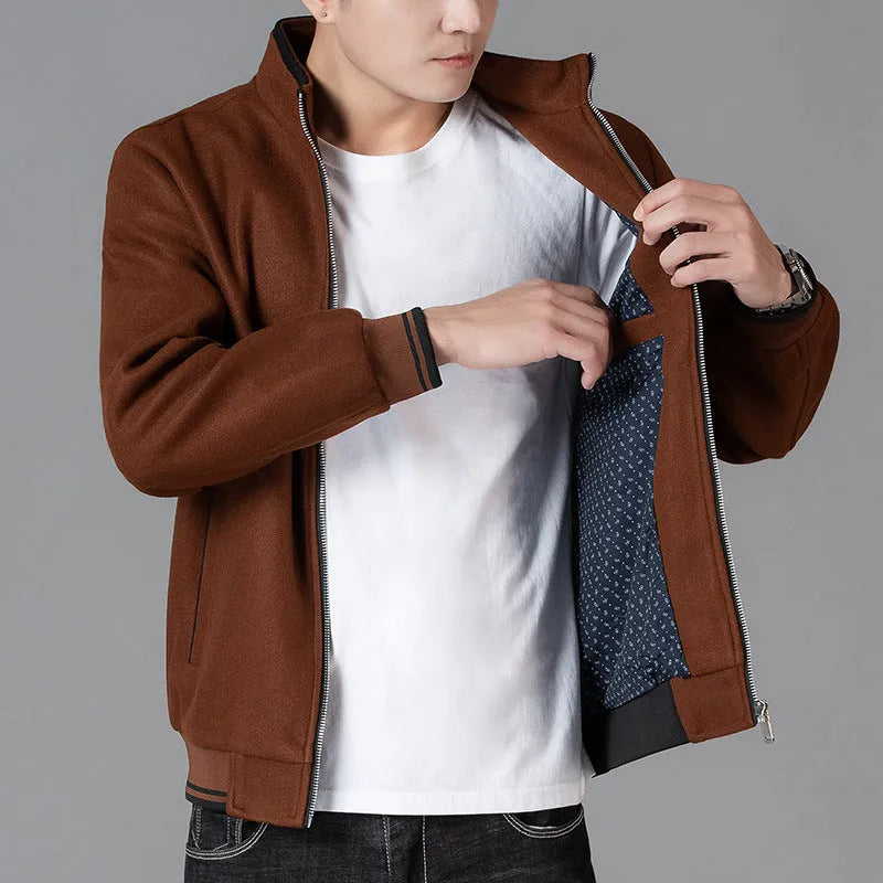 Men's grey polyester fleece sports jacket with long sleeves and a stash pocket on the chest.