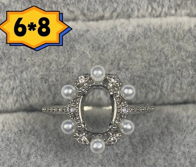 Oval denier ring with open mouth design, 6x8mm main stone and five-pointed star decoration