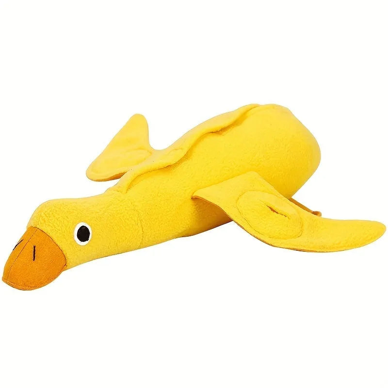 Yellow teddy dog toy with central duck doll, featuring a squeaker and treat leak compartment.