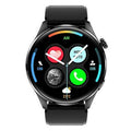 Black smartwatch with round colour screen and silicone strap on a wrist.
