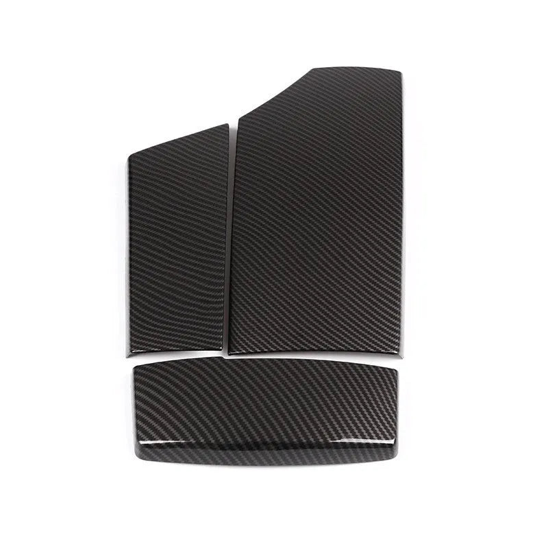 Three ABS carbon fibre pattern armrest box protective covers showing buckle attachment points