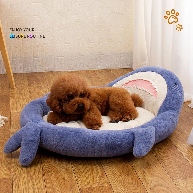 Blue shark pattern velvet pet bed for dogs or cats on a floor.