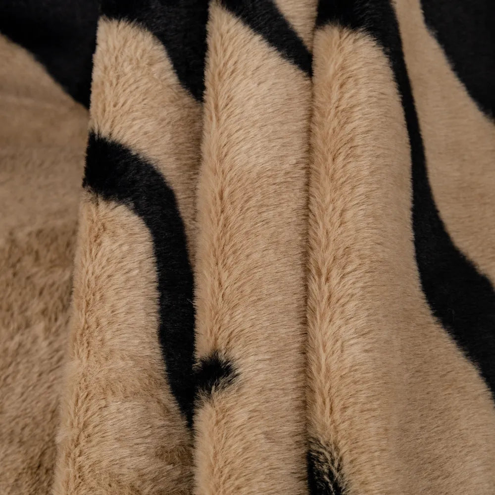 Zebra pattern flannel sofa cover with non-slip design shown on living room furniture
