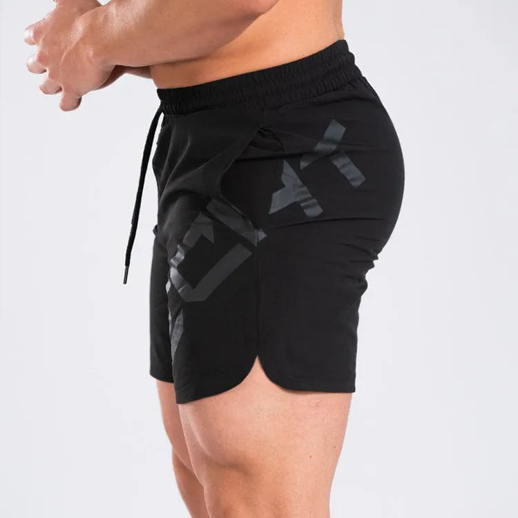 Men's black elastic training shorts with a mid-waist and knee-length cut for summer sports.
