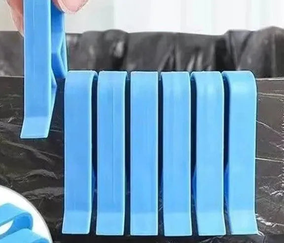 Transparent plastic non-slip clip for holding a garbage bag on the rim of a bin.