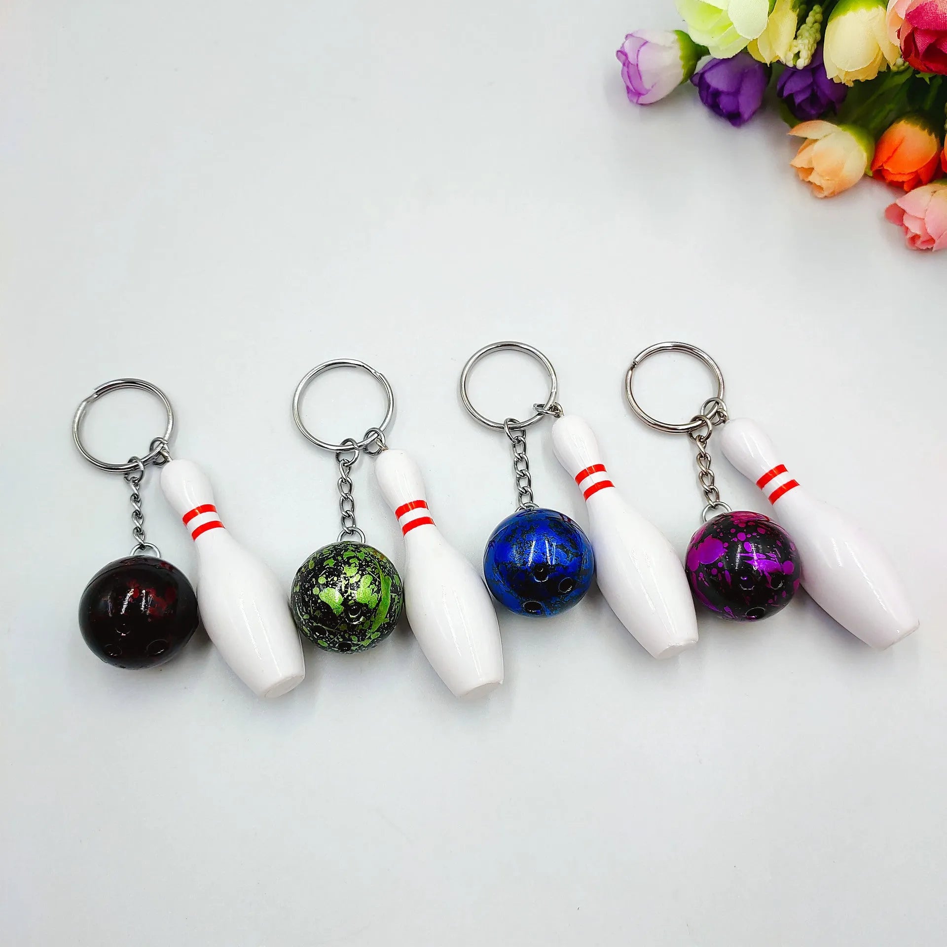 Mini bowling ball simulation keychain pendant in dark red, blue, purple and green colour options