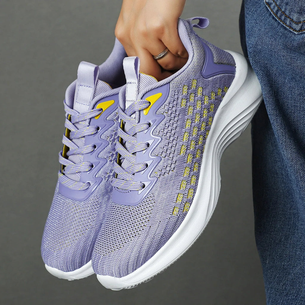 Women's Lavender Purple Flyknit running shoes with striped pattern and mesh upper on EVA sole.