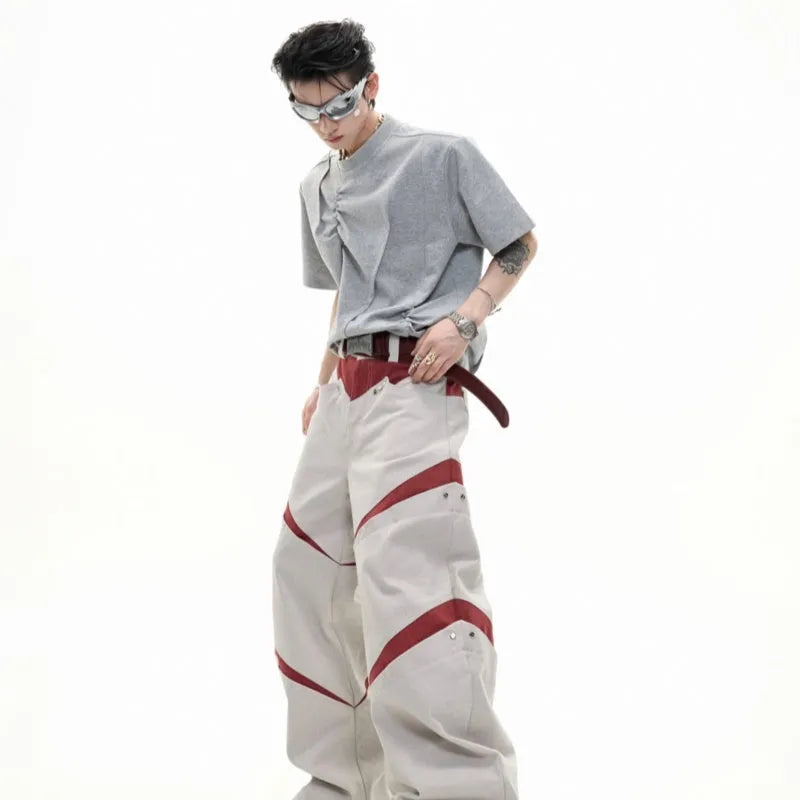Men's loose grey cotton t-shirt with three-dimensional pleats and asymmetric stitching detail.