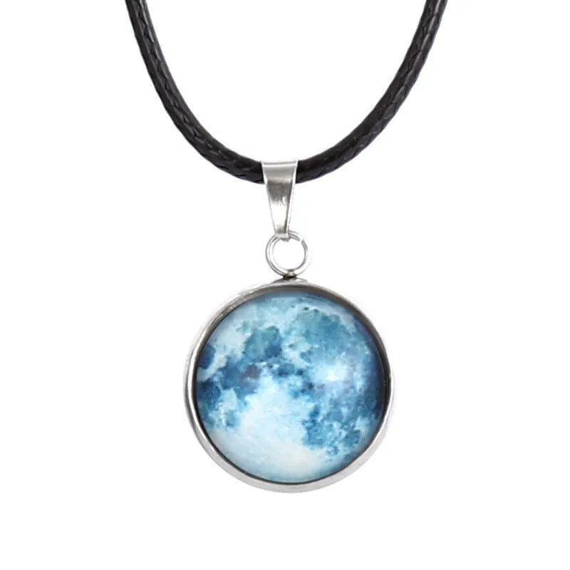 Close-up of a luminous constellation model glass pendant on an alloy necklace chain with extension.