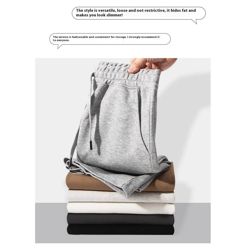 A pair of straight-cut cotton summer shorts in a neutral colour on a plain background.