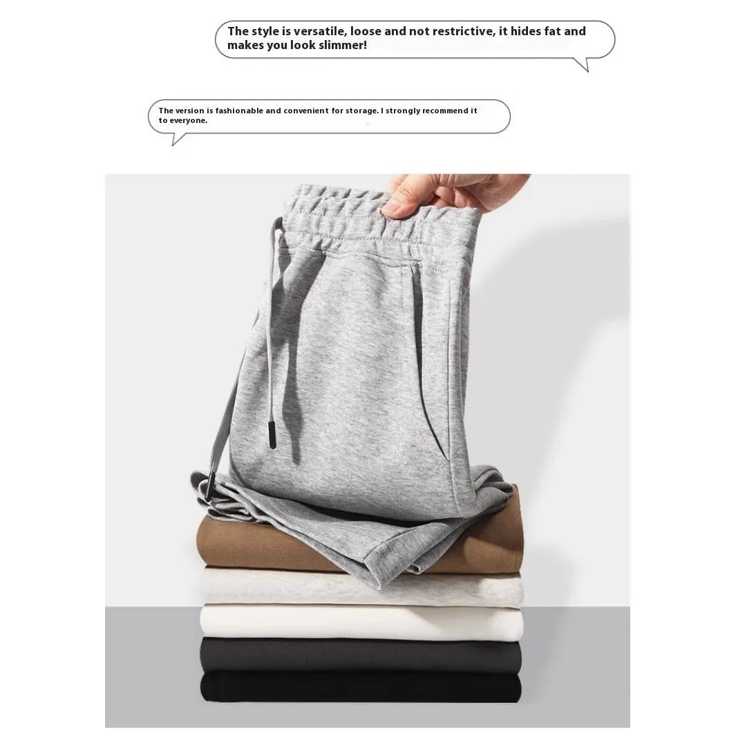A pair of straight-cut cotton summer shorts in a neutral colour on a plain background.