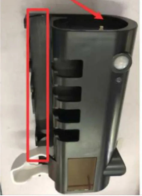 Black and white intelligent UV toothbrush steriliser with automatic toothpaste squeezer mounted on a bathroom wall.
