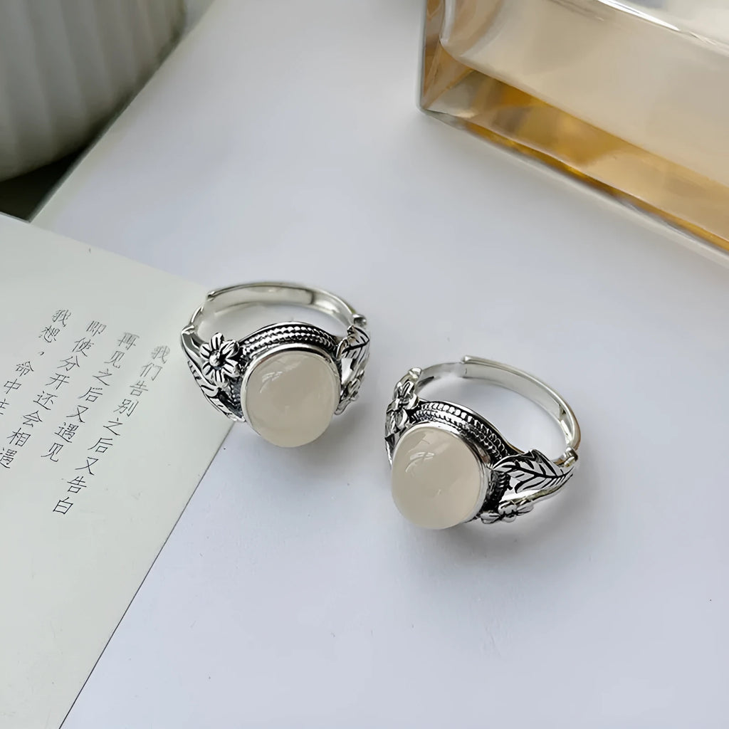 Adjustable copper vintage ring with white chalcedony stone and open mouth design