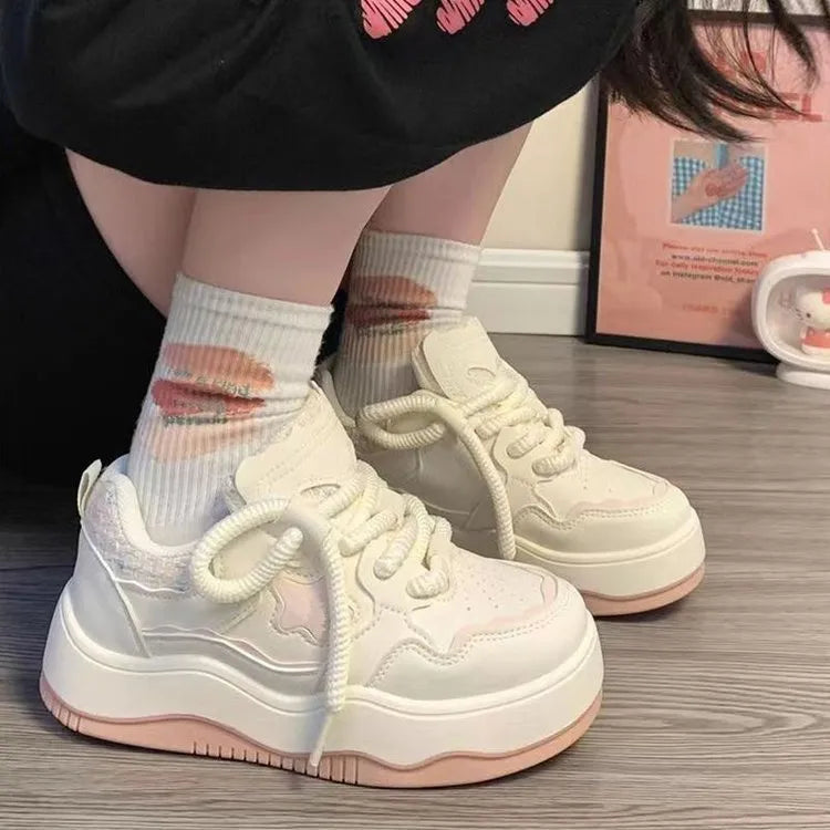 Women's green platform sneakers with patent leather finish and round toe front lace-up design
