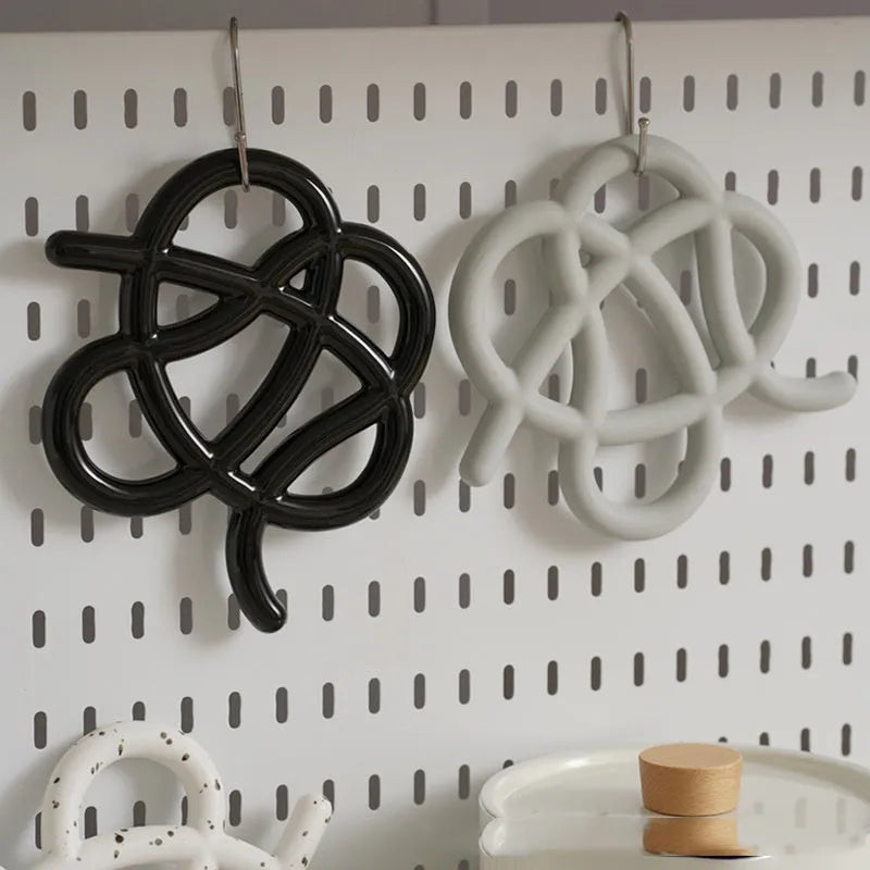 Ceramic heat proof mat in irregular shape on dining table
