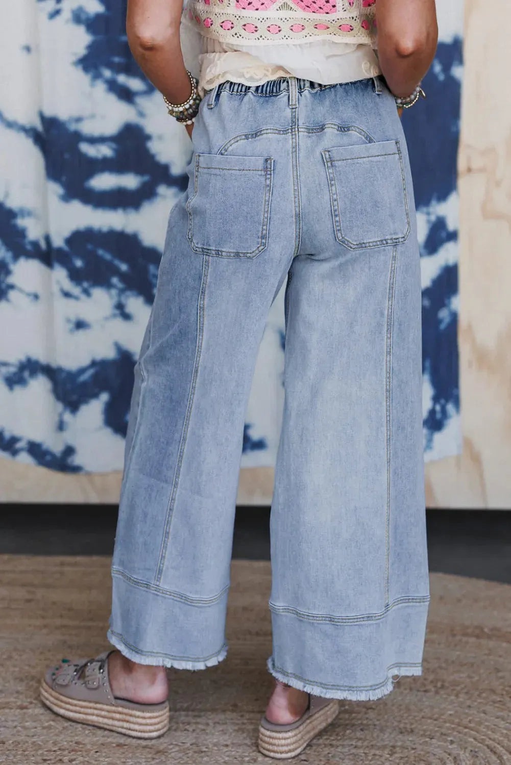 Beau blue wide leg denim trousers with drawstring waistband and raw hem finish