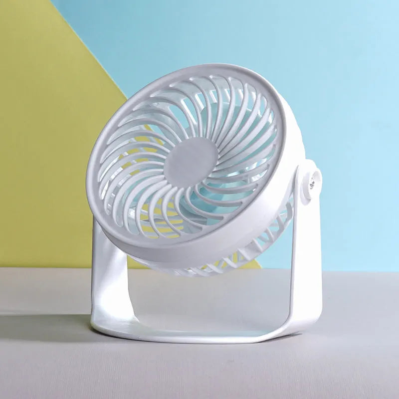 Small USB-powered desk fan shown in clip-on and floor-standing styles on a wooden desk.