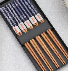 Five pairs of Japanese-style patterned bamboo chopsticks in lucky cat or elegant blue designs with cartoon patterns