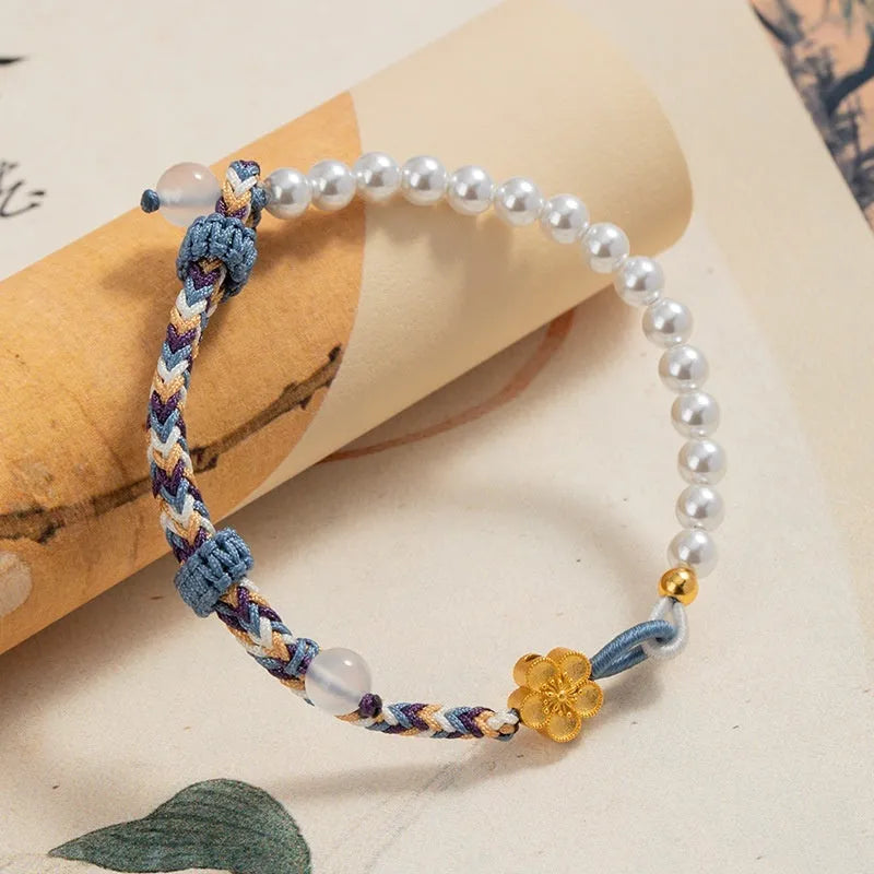 Peach-coloured Chinese flower weaving carrying strap with pearl accents on cord material