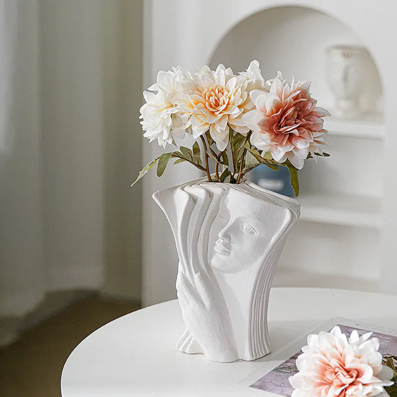 Ceramic decorative book stand in a modern simplicity style on a wooden desk.