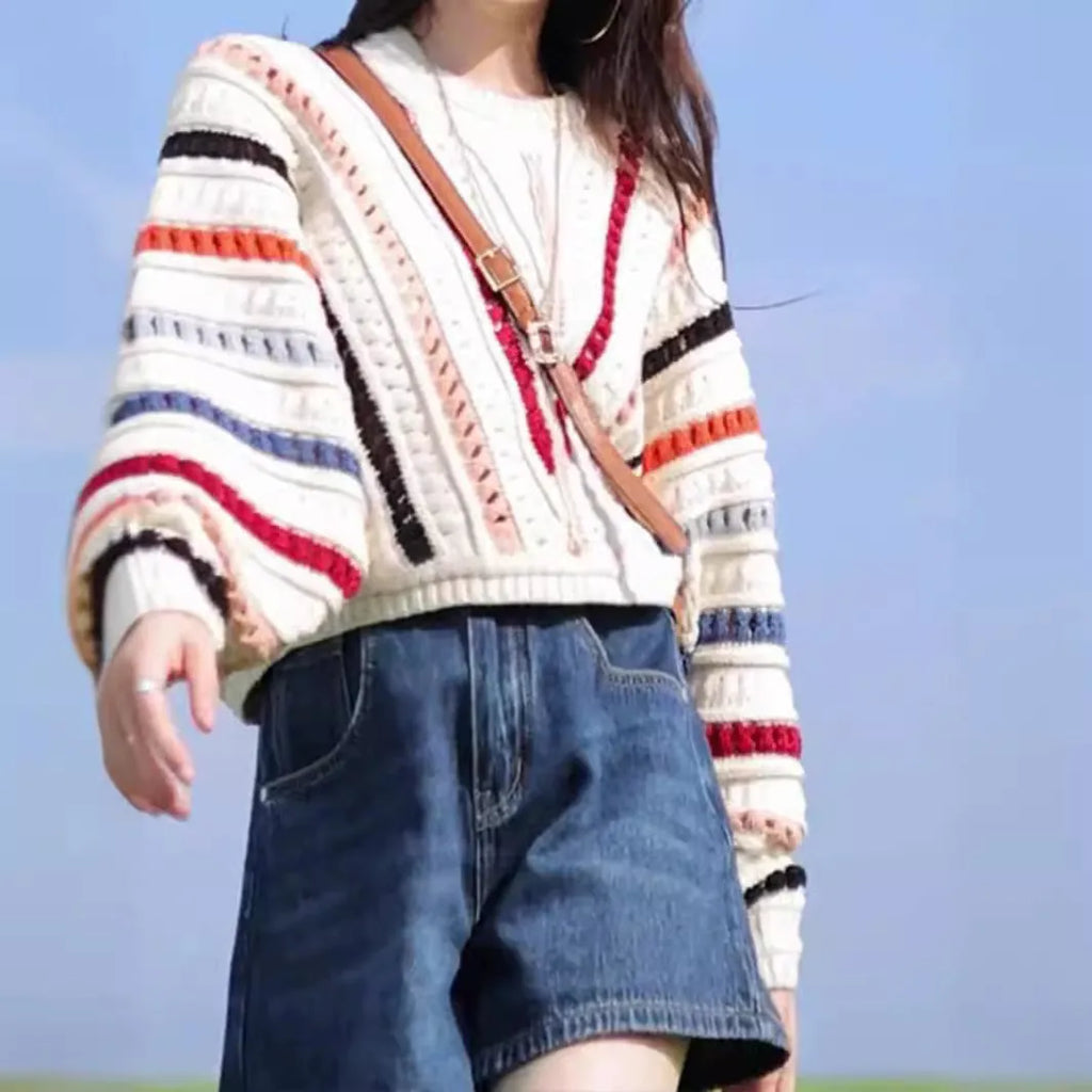 Colourful rainbow striped pullover sweater with batwing sleeves and hollow knit texture