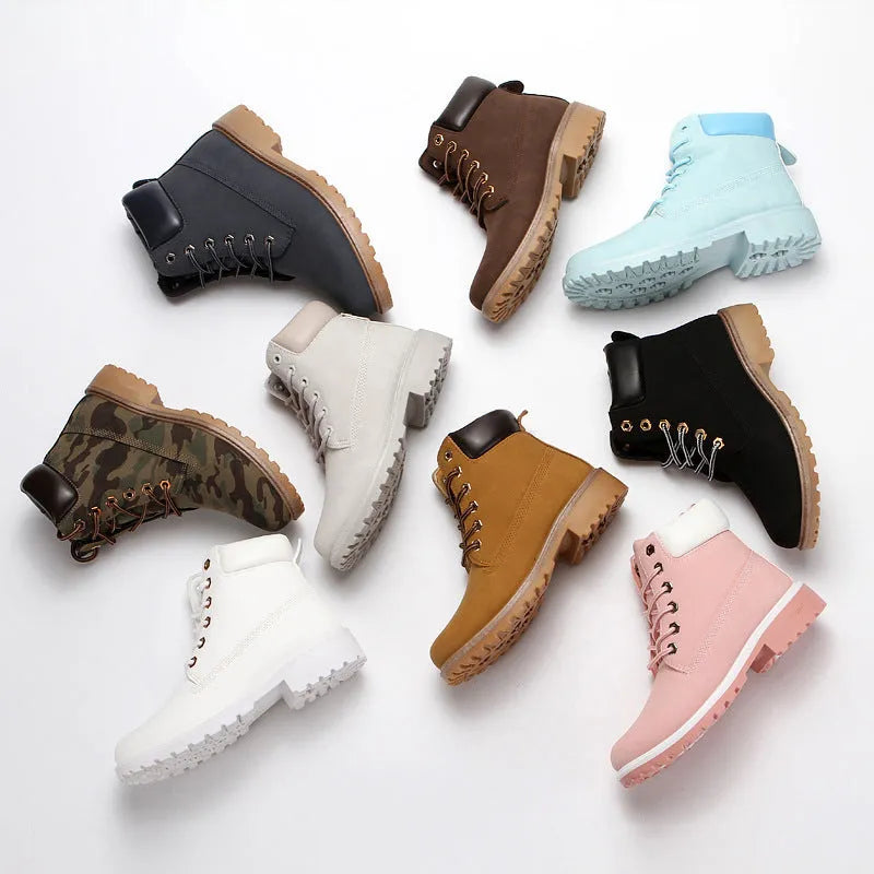 Men's pink Martin boots with velvet lining, flat sole, and round toe on a lace-up high-top.