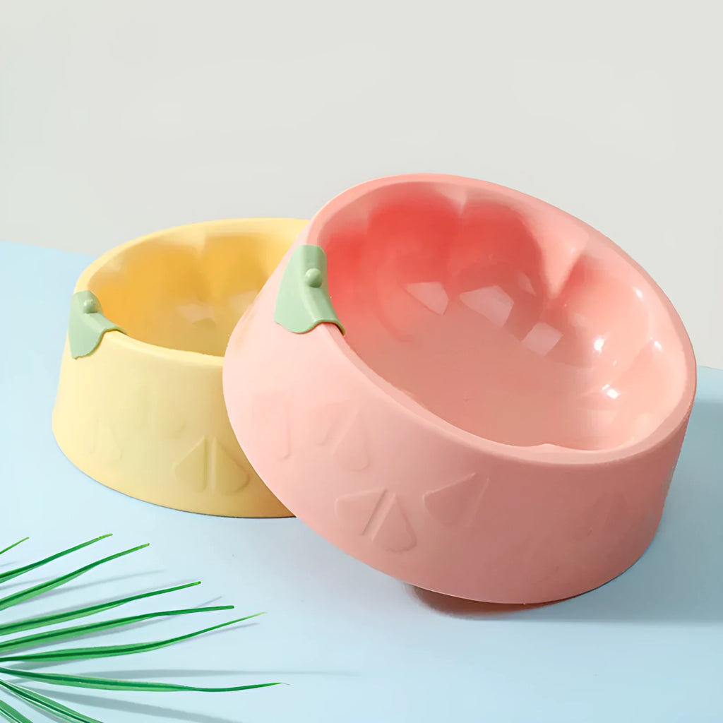 Green plastic anti-tipping pet bowl for dog and cat food and water.