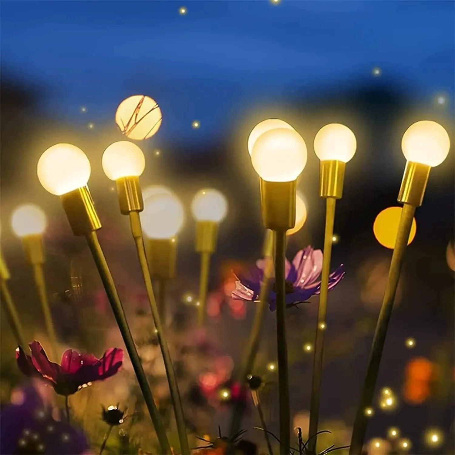 Solar-powered LED ground spike garden light with automatic sensor in lawn