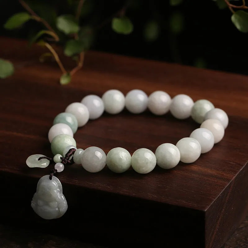 Jade hanging charm bracelet with geometric design and Buddhist symbolic pendant
