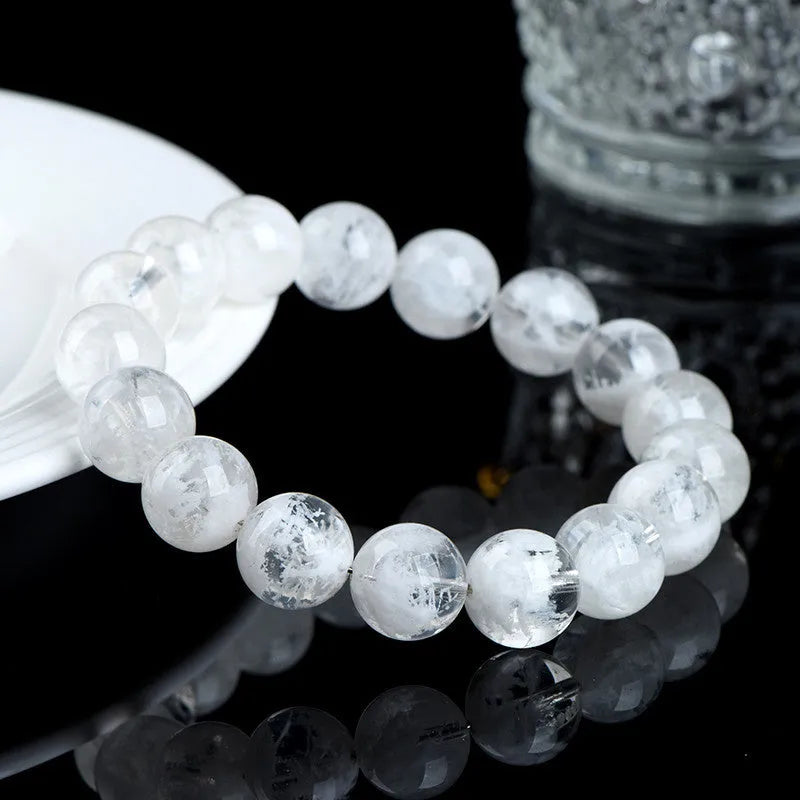Women's crystal bracelet with natural blizzard snowflake beads featuring Ruyi and Xiangyun Chinese symbols